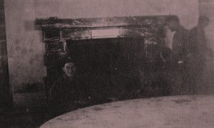 Ray P. Eager of the 101st Airborne in front of the fireplace, with the table in the foreground (Image courtesy of Jon D. Eager)