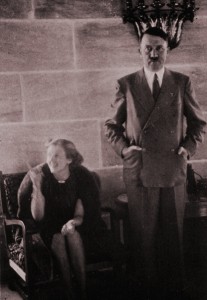 A smiling Eva Braun with an awkward-looking Hitler in the main reception hall