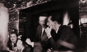 Adolf Hitler in front of the fireplace with Joseph and Helga Goebbels