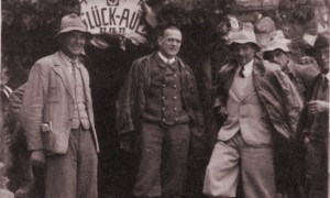 Chief Engineer Hans Haupner with the Reck brothers, as work begins on the tunnel